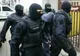 Doi tâlhari, săltați din pat cu mascații și duși în arest